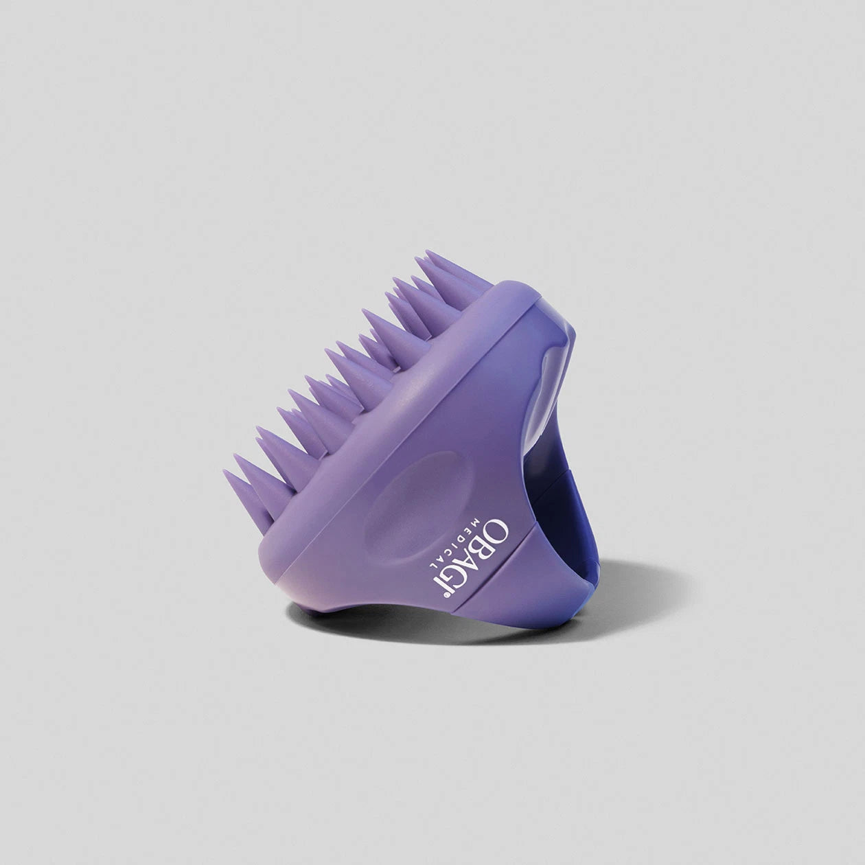 Purple Obagi Scalp Massager image on grey background