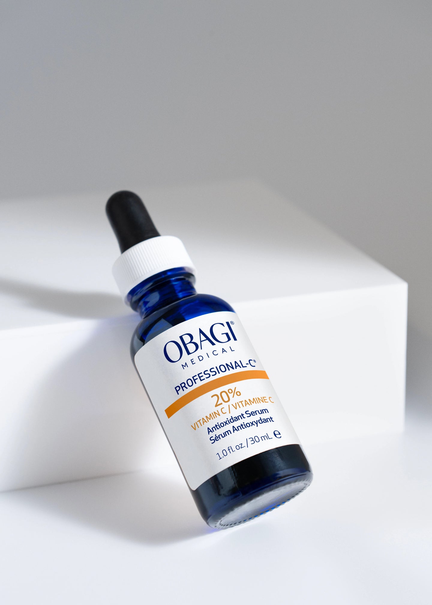Professional-C Vitamin C Antioxidant Serum stylized image of bottle tilted on block